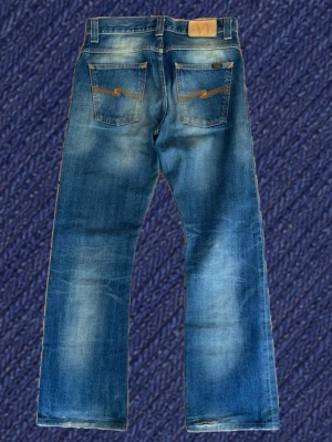 Selvedge archive bootcut nudie jeans regular Ralf (discontinued) - Tjena!  📍 Säljer nu ett par Selvedge bootcut nudie jeans som inte produceras längre!  📍 Inga skador eller liknande!  📍 Modell: regular Ralf Selvedge  📍 Storlek: 30/32  📍 Mått: midja: 40cm längd: 102cm lår: 24cm benöppning: 22cm (måtten kan variera ±1 cm)  📍 Fråga gärna frågor och priset kan såklart diskuteras!