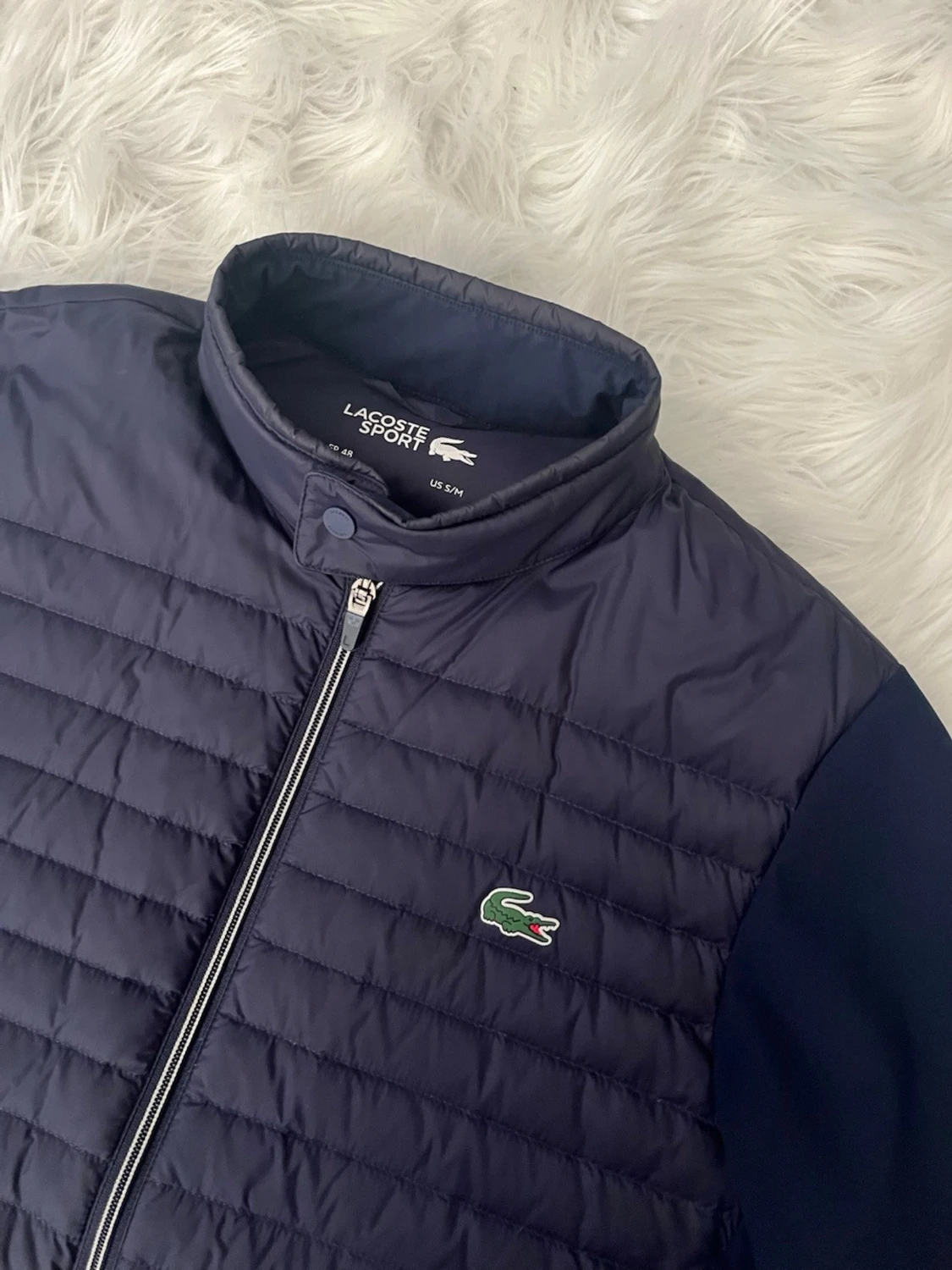 Mörkblå pufferjacka från Lacoste - 1