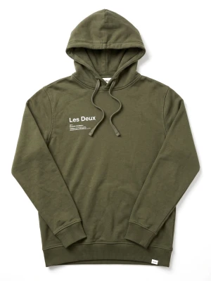 Olivgrön hoodie från Les Deux - Snygg olivgrön hoodie från Les Deux med tryck på bröstet och ryggen.använd och lite urtvättat tryck Klassisk modell med huva och dragsnören samt ribbade muddar vid ärmar och nederkant. Tillverkad i mjuk bomullsblandning som känns skön mot huden. Perfekt för en avslappnad streetwear-look.