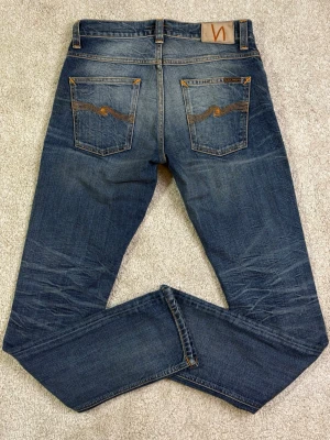 Nudie Jeans - Stl w30, l32 - NUDIE JEANS - Storlek: W30/L32 Modell: GRIM TIM, med sjuka fades! | Användning: Varsamt använda, fint skick | Nypris: Cirka 1800 SEK