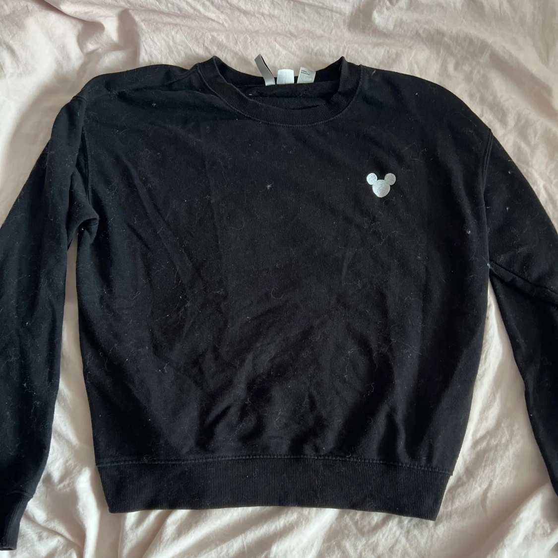 Svart sweatshirt med Disney-tryck