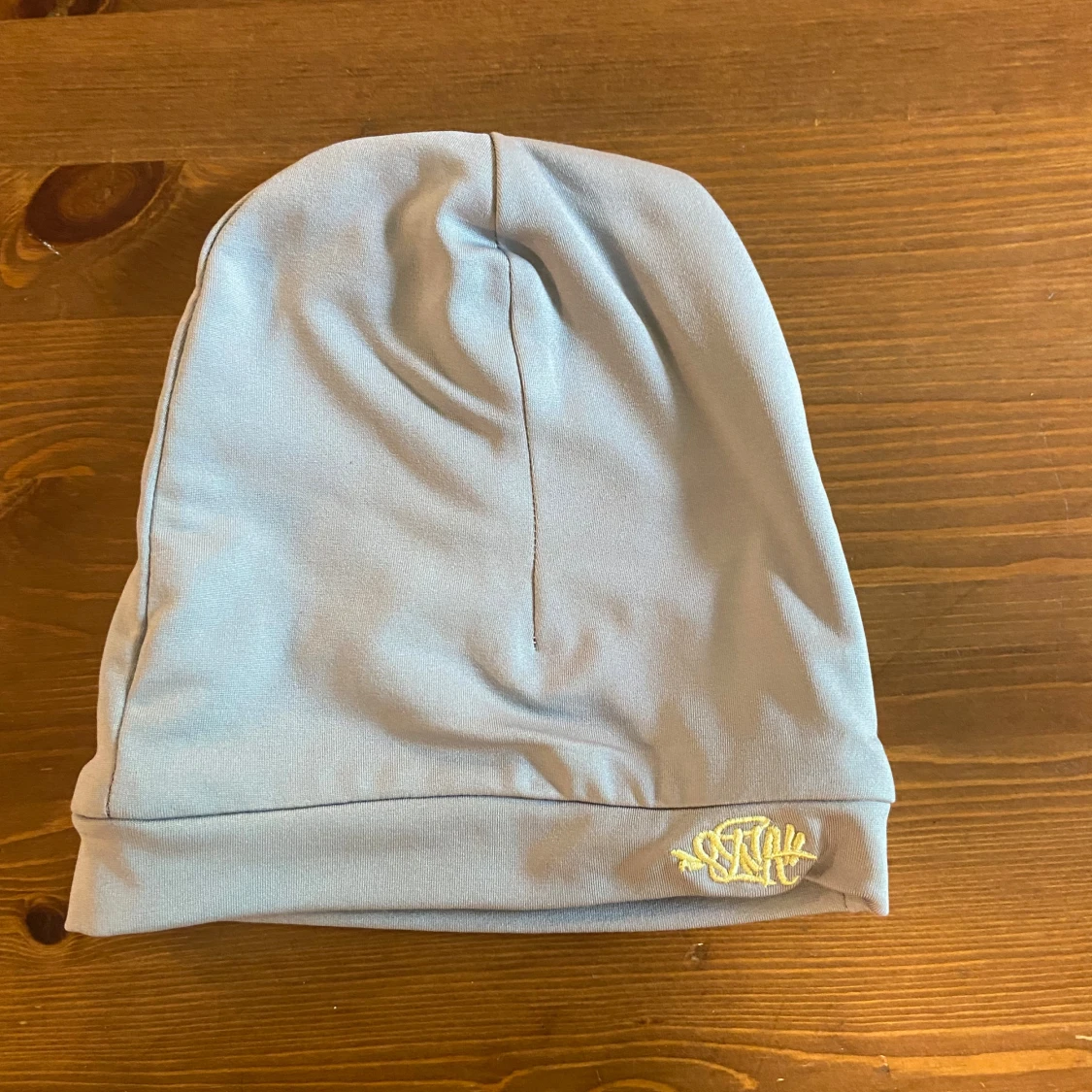 Ljusblå syna world mössa 