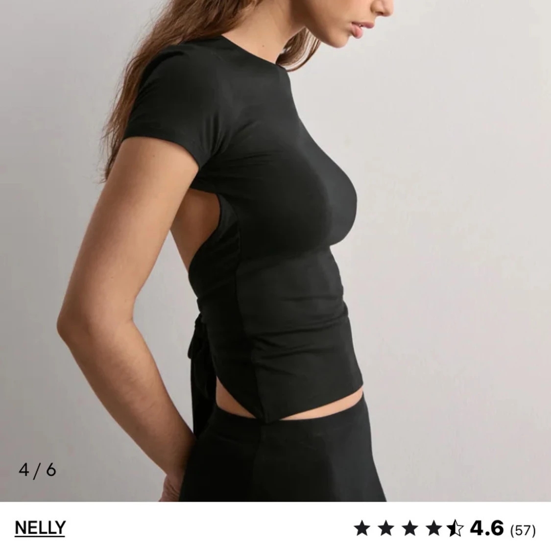 Svart croppad topp med öppen rygg från Nelly - 2