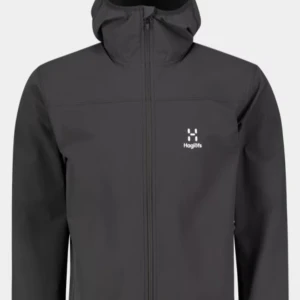 Svart vindjacka med huva från Haglöfs - Säljer en svart vindjacka från Haglöfs med hel dragkedja och fast huva. Jackan har diskret logga på bröstet och är tillverkad i syntetmaterial med meshfoder på insidan. Perfekt för utomhusaktiviteter och enkel att matcha.