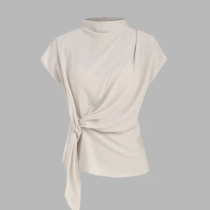 Beige med knyt - Superfin! Slutsåld på hemsidan, prislappen kvar