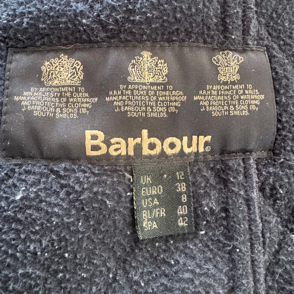 Marinblå quiltad jacka från Barbour - 1