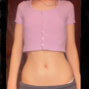 Ljuslila croppad ribbad topp med knappar - Superfin ljuslila croppad topp från pull&bear   (jag är 168cm lång) Toppen har knappar framtill och en rundad urringning. Perfekt att styla till jeans eller kjol för en trendig look.