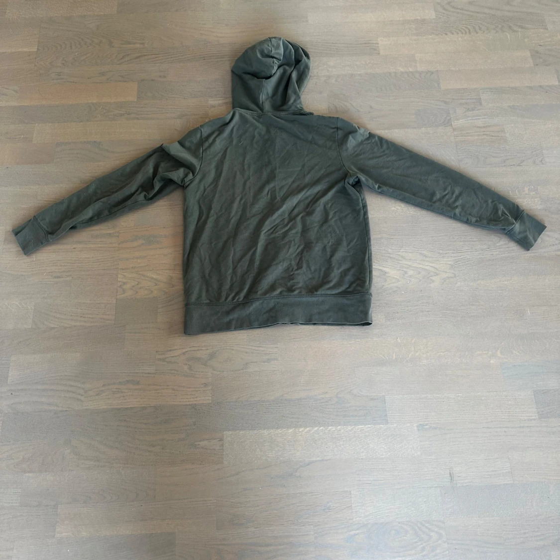 Mörkgrön hoodie med dragkedja och huva - 1