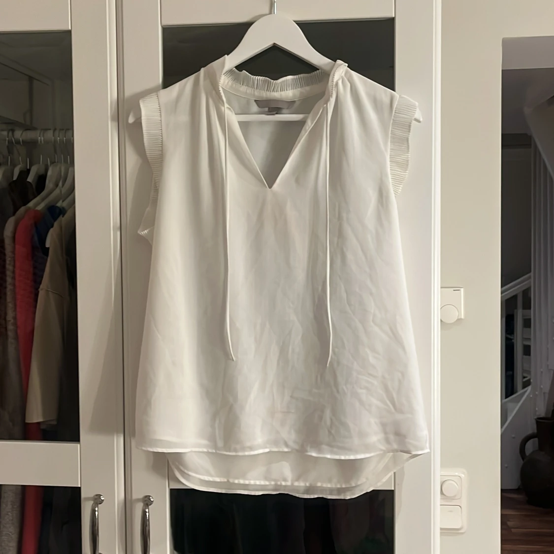 Vit ärmlös blus från H&M