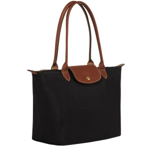 Svart longchamp väska byte - Har en svart longchamp väska i strlk m jag gärna byter mot en likadan med mindre hantag och i anna färg (gärna vit eller rosa som på bilderna) 