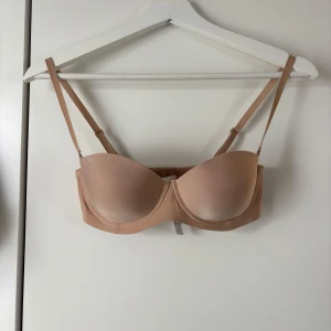 Beige bh med justerbara axelband - BH från Intimissimi
