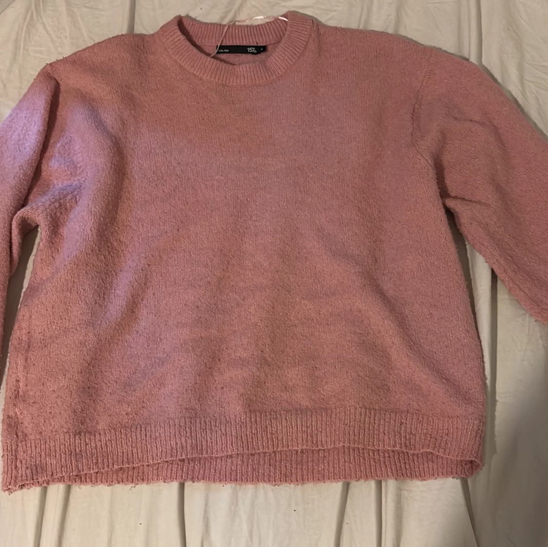 Rosa stickad tröja med rund hals