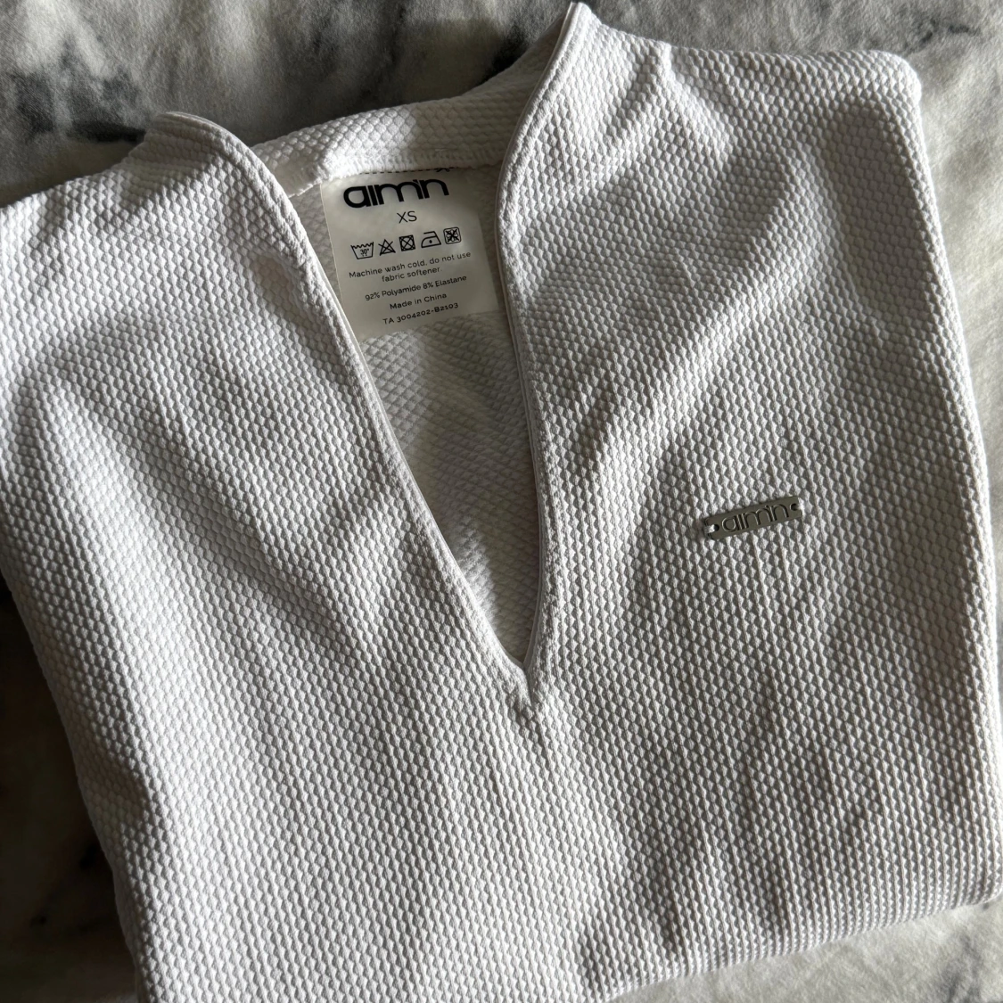 Vit strukturerad topp från Aim'n XS