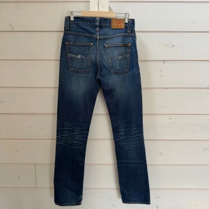 Nudie Jeans - Nudie Jeans (Grim Tim) | Size: W29 L32 | Skick: 8,5/10 vissa små defekter, se bilder | Hör av dig vid frågor och funderingar | Vänliga hälsningar!
