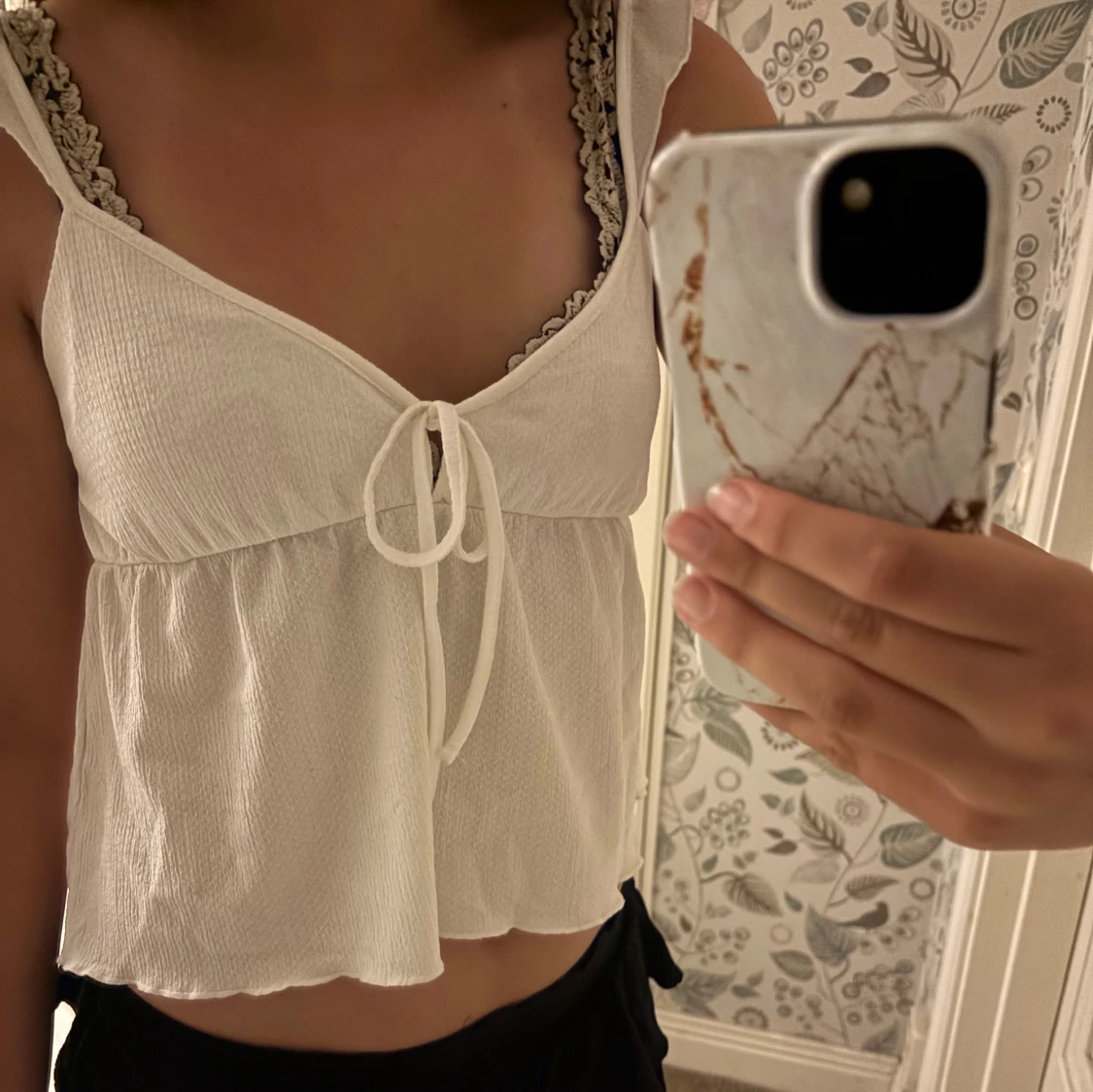 Vit linnetopp från Nelly 