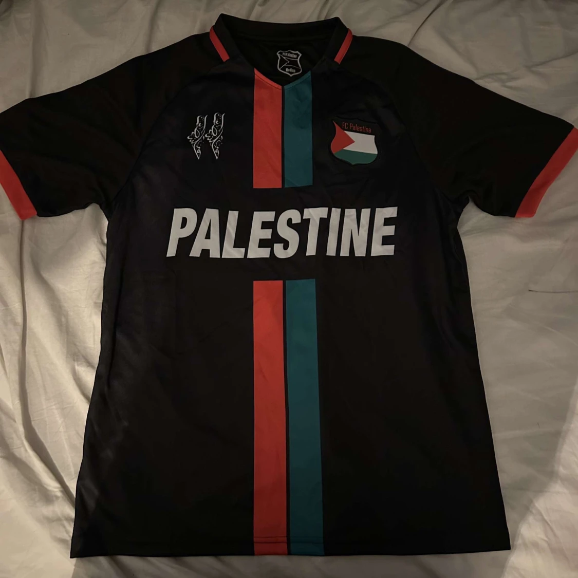 Svart fotbollströja från PC Palestina