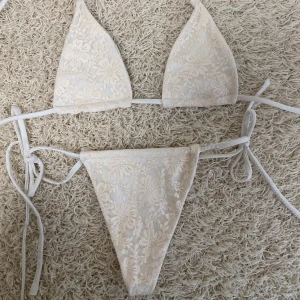 Hand made bikini - Hand made beige lace bikini with adjustable straps. Top is available in a smaller size (aa-a cups) and a bigger one (b-d cups). Completely unused, made for sale.