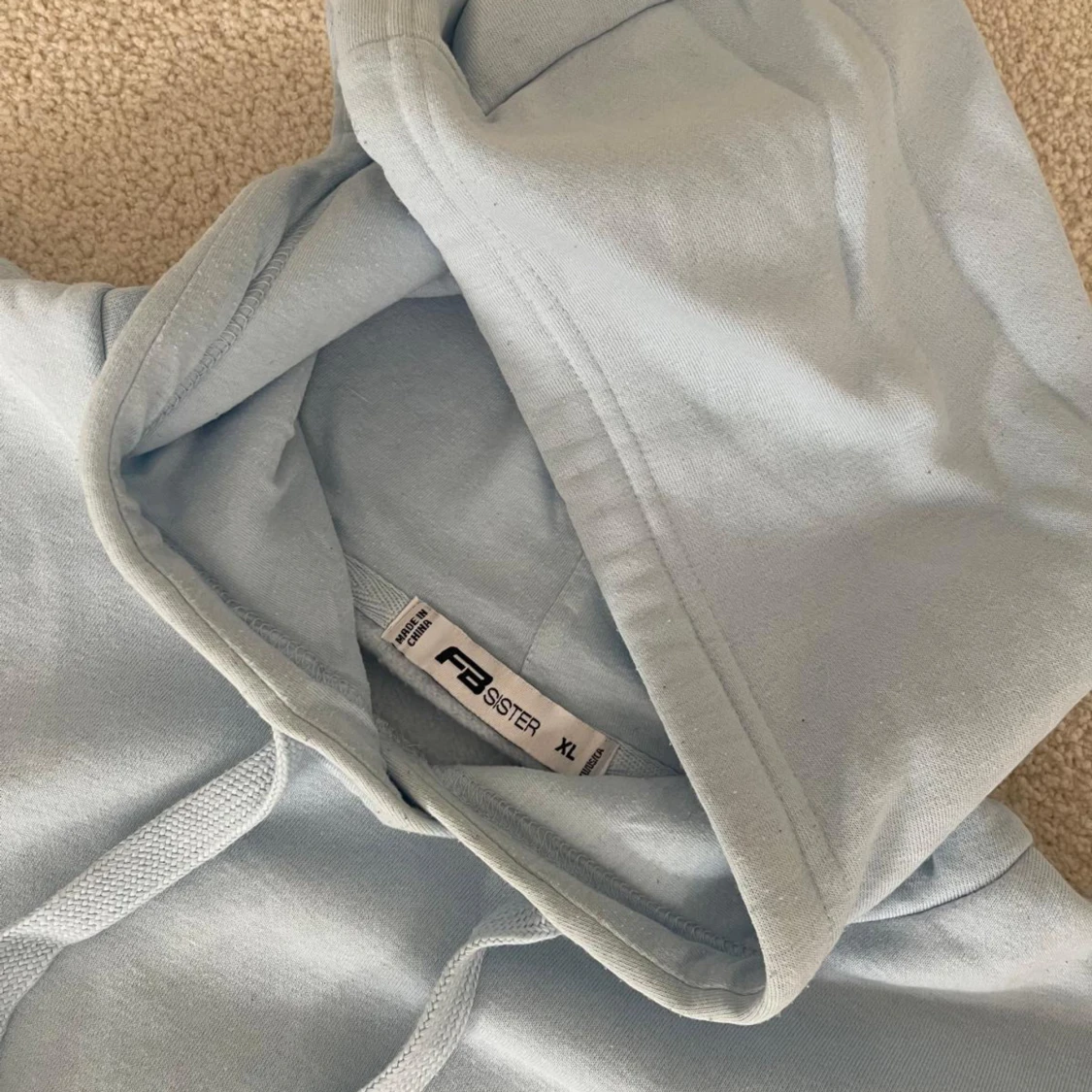 Ljusblå hoodie från FAS - 90