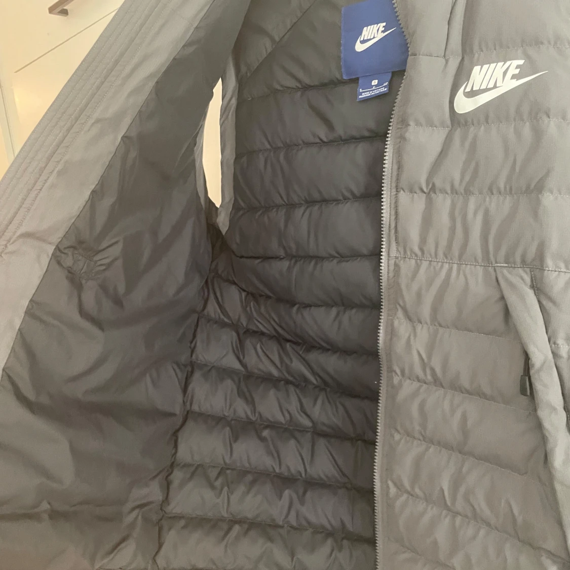 Grå dunväst från Nike - 92