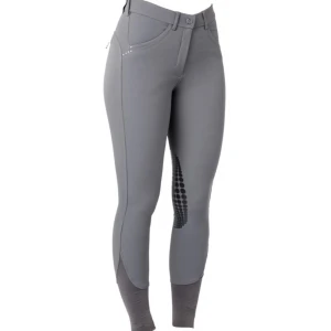 Grå ridbyxor med silikonknä - Snygga grå ridbyxor med silikonknä för extra grepp. De har en hög midja och är perfekta för ridning. Byxorna är stretchiga och bekväma, vilket gör dem idealiska för långa ridpass. De har även dekorativa detaljer vid fickorna.