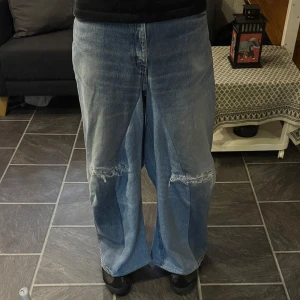 Distressed Light Blue Baggy Flared Jeans - Handmade Light Blue Baggy Flared Jeans w Distressing  Size 33/32 Waist: 38cm Length: 104cm Leg opening: 35cm  *fits a bit smaller than a waist 33!*