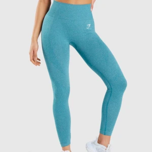  Träningstights Gymshark - Turkosa träningstights från Gymshark med hög midja och tight passform.