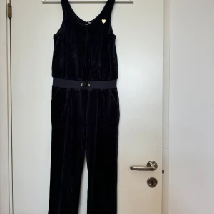 Juicy Couture Jumpsuit in Navy - Navy velvet jumpsuit, with waistband and pockets. Lightly used.