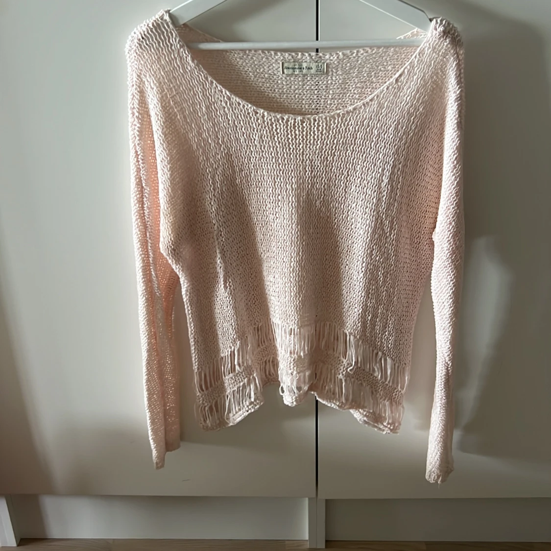 Ljusrosa stickad tröja