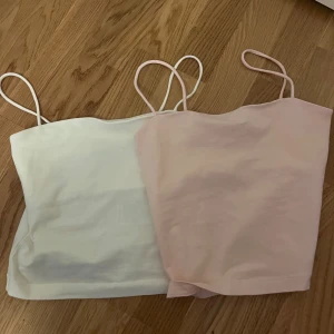 Två toppar från Ginatricot  - En vit och en rosa topp från Ginatricot. Den vita är i storlek xxs och den rosa i xs! Säljer båda för 150kr. Om du bara vill ha en av dem så kontakta mig 🩵