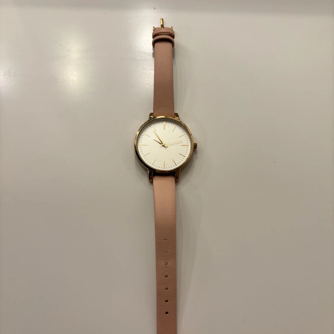 Elegant klocka med rosa armband