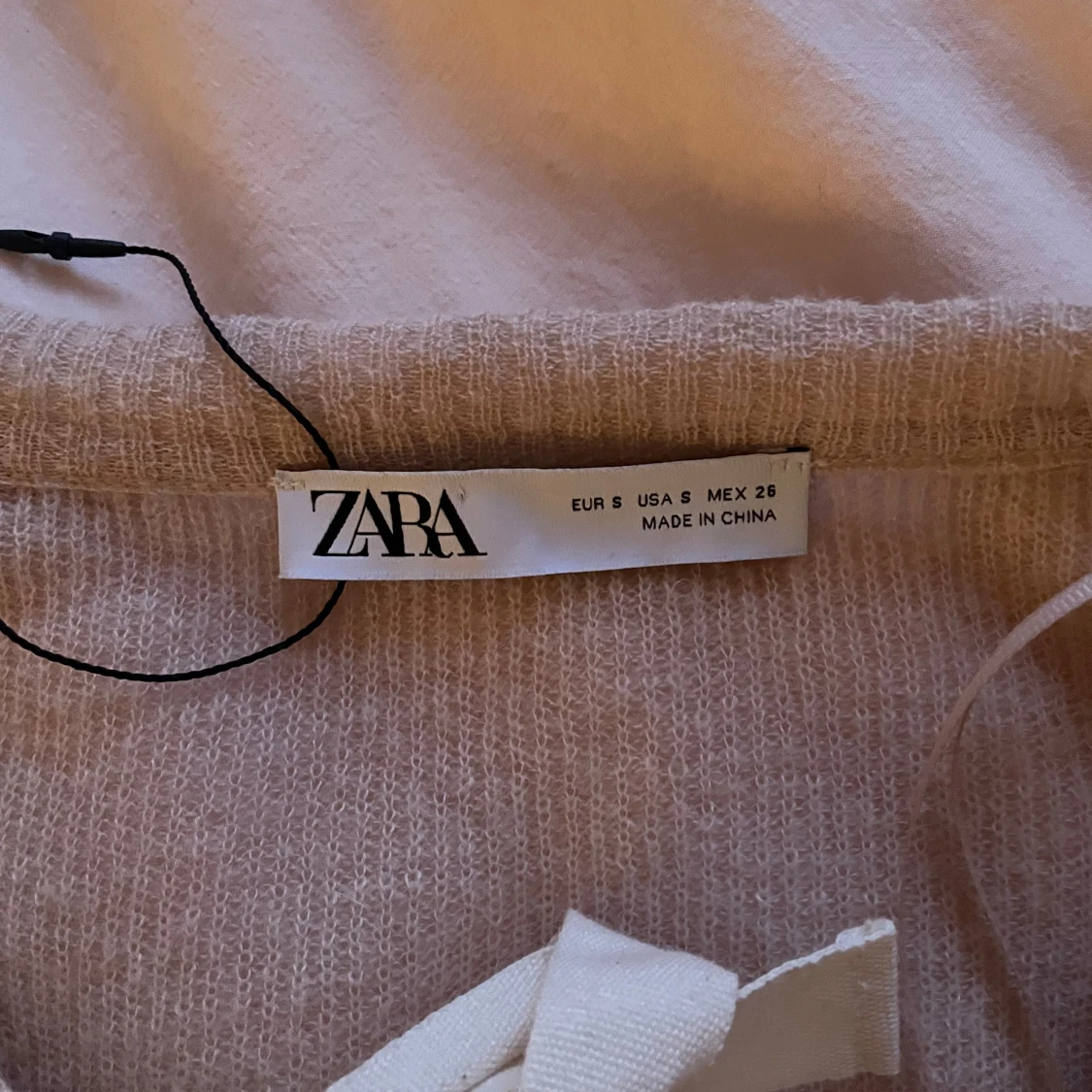 Ljusrosa kofta med rosetter - 2