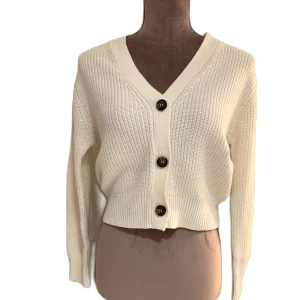 Stickad cardigan  - V-ringning Nedsänkta axlar Stickad cardigan 