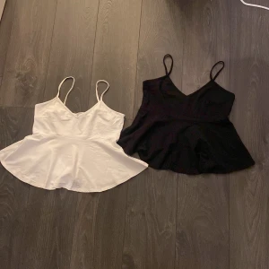 Linnen - Säljer två fina Stockholmstil-linnen från Ginatricot i svart och vitt. Antingen 60 kr/st eller 100 kr tillsammans. (Stl M men passar xs/s.)