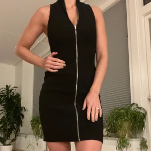 Black dress with zipper  - Black stretchy dress with silver zipper.in great condition! Assorting my closet and selling clothes they no longer fit. 