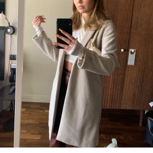 Kappa - Beige kappa. Storlek s, jag är 170 cm lång.