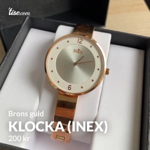 INEX KLOCKA  - Jag har aldrig använt denna klocka så därför säljer jag denna. Jag är en silver person och inte guld- brons. Jag vill bli av med denna så fort som möjligt