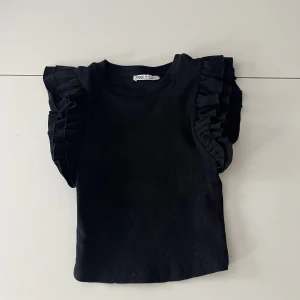 Volang topp Zara - Svart volang topp från Zara