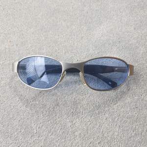 True Y2K era Metal and gummy sunglasses with blue glass lenses.  Super cool, high quality and true Y2K 
