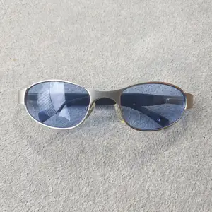True Y2K era Metal and gummy sunglasses with blue glass lenses.  Super cool, high quality and true Y2K 