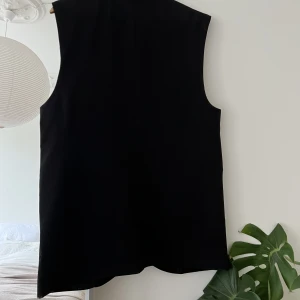 Kavaj utan ärmar - Oanvänd kavaj utan ärmar. 