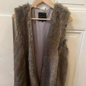 Faux fir gilet from New Look. Perfect condition. EU size 40/UK size 12.