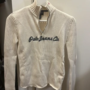 Ralph Lauren half-zip - Supersnygg stickad tröja från Ralph Lauren i fint skick. 