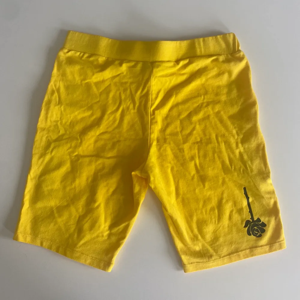 Yellow Biker Short. Brand Petal by Petals and Peacocks. The black on the side is slightly peeling but barely noticeable. . Shorts.