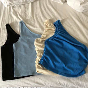 One shoulder top - 4 olika one shoulder toppen, två blå, en svart och en beige. Alla för 230, en för 70kr💓