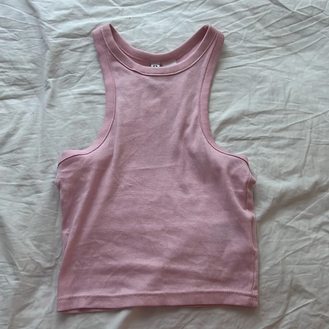 Ett linne från HM i storlek xs