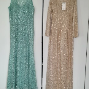 Festklänningar  - Nya oanvända festklänningar   Grön : storlek L/XL pris 500 kr  Den guldiga: storlek M/L pris 500 kr 
