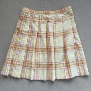 Minikjol - Rutig a-formad minikjol med dragkedja i sidan. Gul, rosa, orange & lila Nyskick 