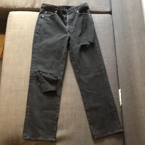 Grey distressed jeans - Grey distressed jeans from H&M, 3 buttons for the waist. Never worn, just want to get rid of it. There is a big cut out in one of the legs - these would make cute shorts if cut.