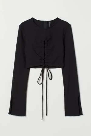H&M toppar  - säljer en svart och en orange långärmad topp, oanvända kvar i plastpåsen. Säljer båda tillsammans.  Små i storleken