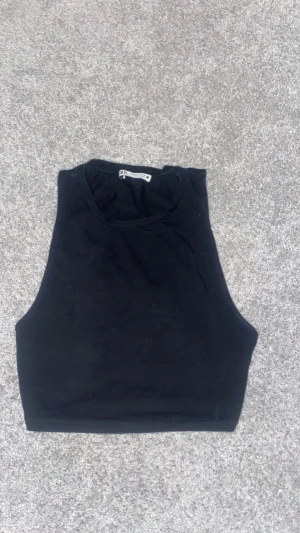 Linne - Ett svart linne, bra skicka